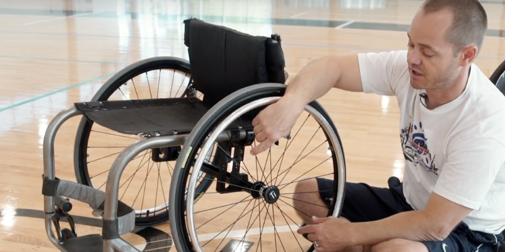 Man cleaning his wheelchair