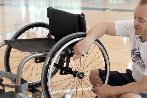 Man cleaning his wheelchair