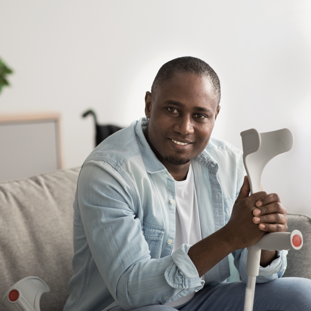 Man sitting with his crutches