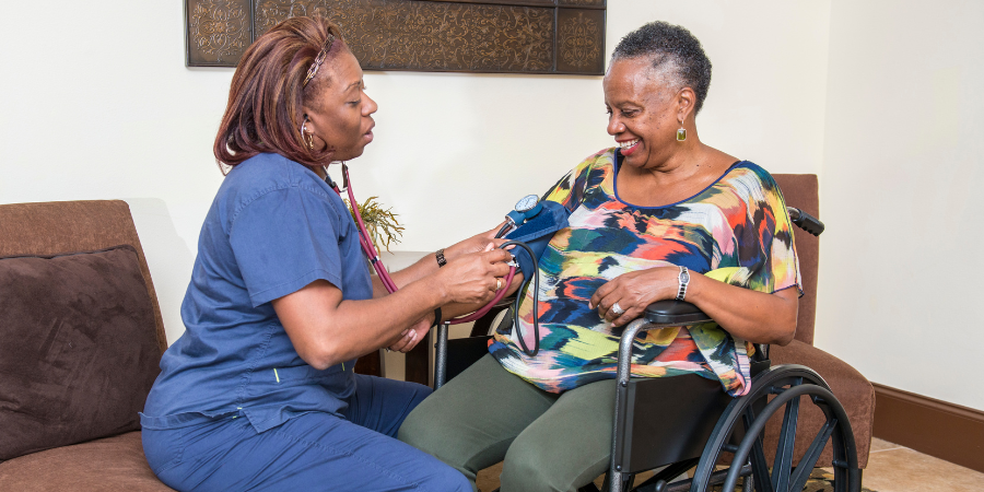 Woman having her blood pressure taken