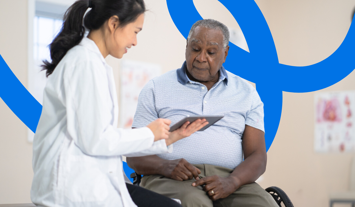 MAN IN WHEELCHAIR TALKING TO DOCTOR