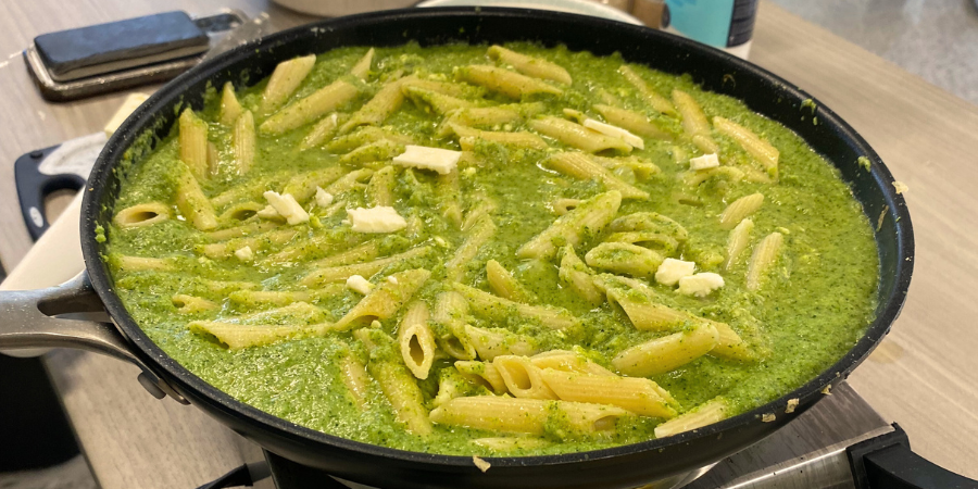 Green Veggie Pasta Sauce in a pan on a hot surface